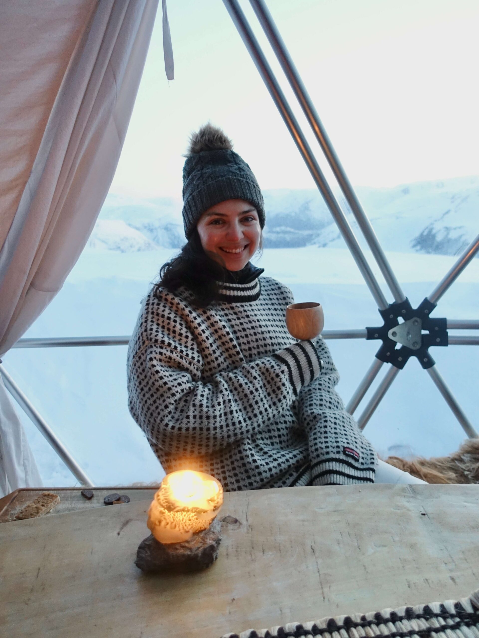 Blog author sitting at a tabe in Norway