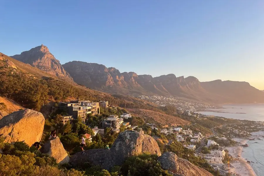 Golden light on the 12 Apostles mountains from The Rock, a Cape Town sunset spot