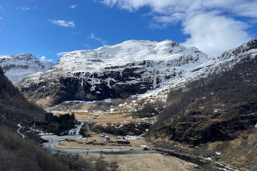 A view of snow-capped mountains in Norway from the train windows.