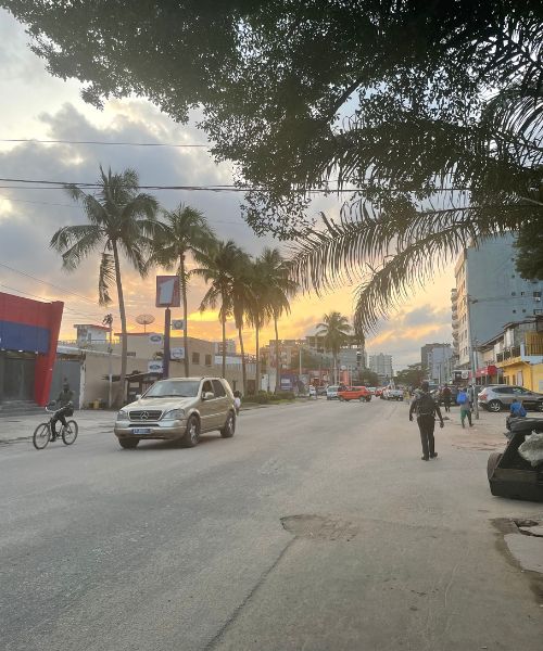 Rue du Canal, a street in the Zone 4 neighborhood of Abidjan, Côte d'Ivoire, at sunset