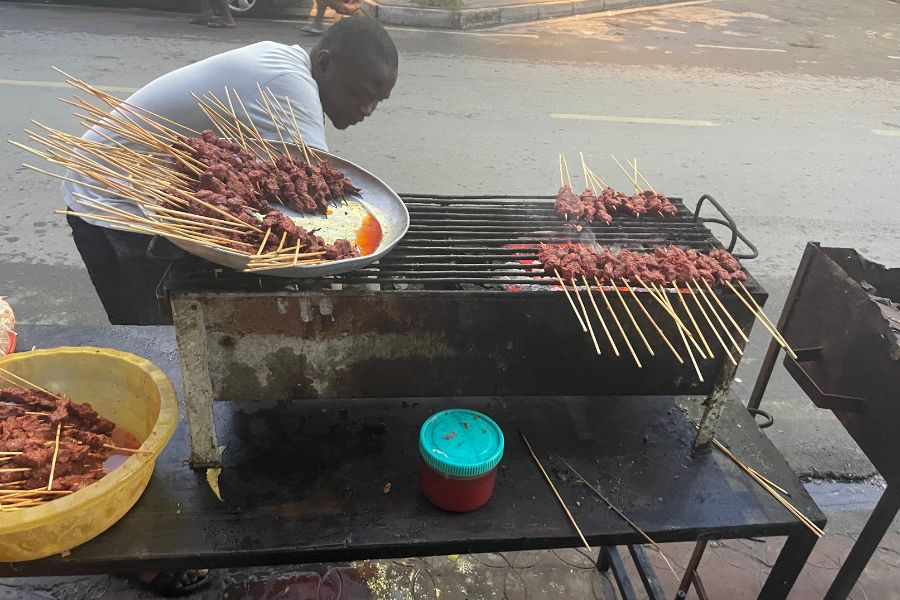 Nyama choma, skewers of marinated meat, roast over a grill on the streets of Mombasa