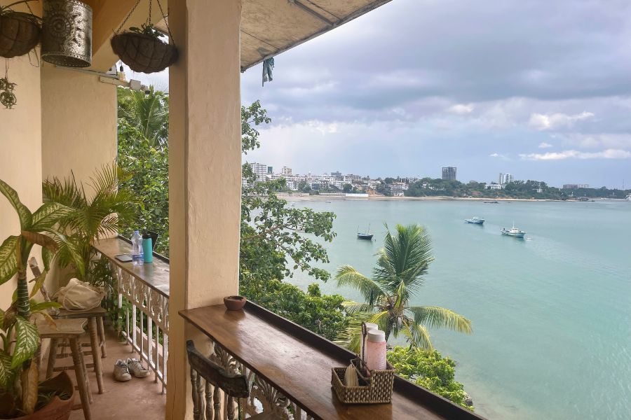 The balcony at Tulia Old Town hostel in Old Town Mombasa, Kenya, overlooks the beautiful blue river.